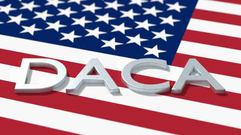 A close up of the word coach on an american flag