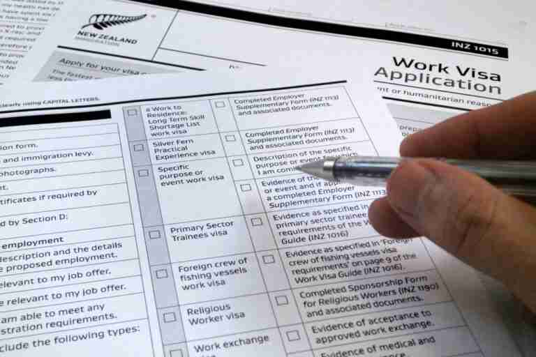 A person is filling out an application form.